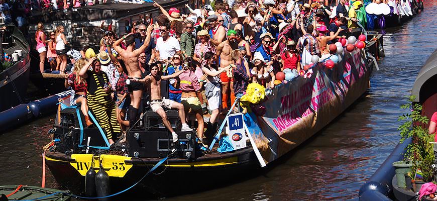King's Day boats line the canals of Amsterdam